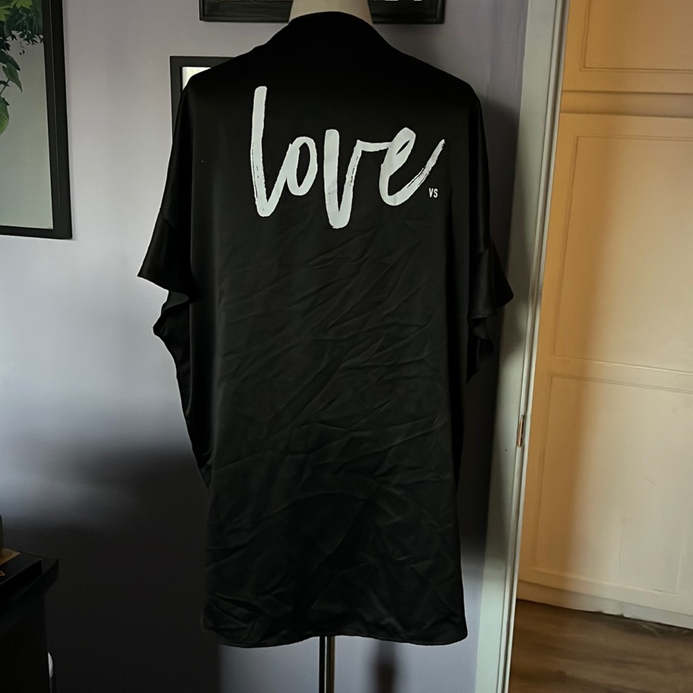 Victoria’s Secret short black robe with front tie and ruffled detailing.